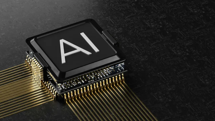 Close-up of an AI-labeled microchip with gold circuitry on a dark textured board representing artificial intelligence technology.