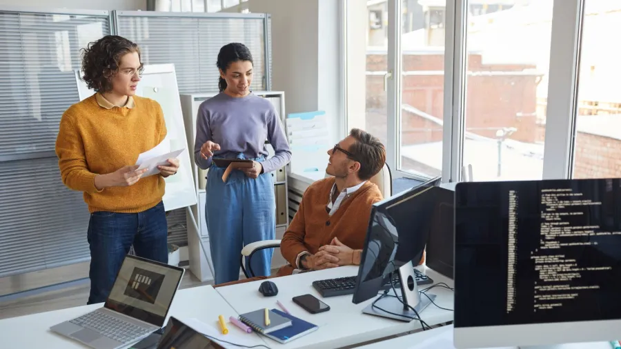 a group of people in an office