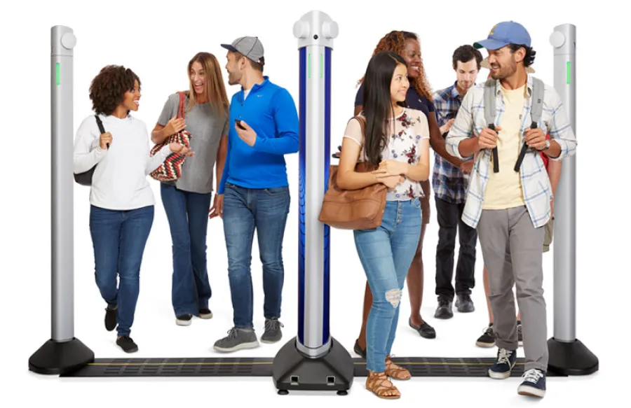 a group of people standing next to a light pole