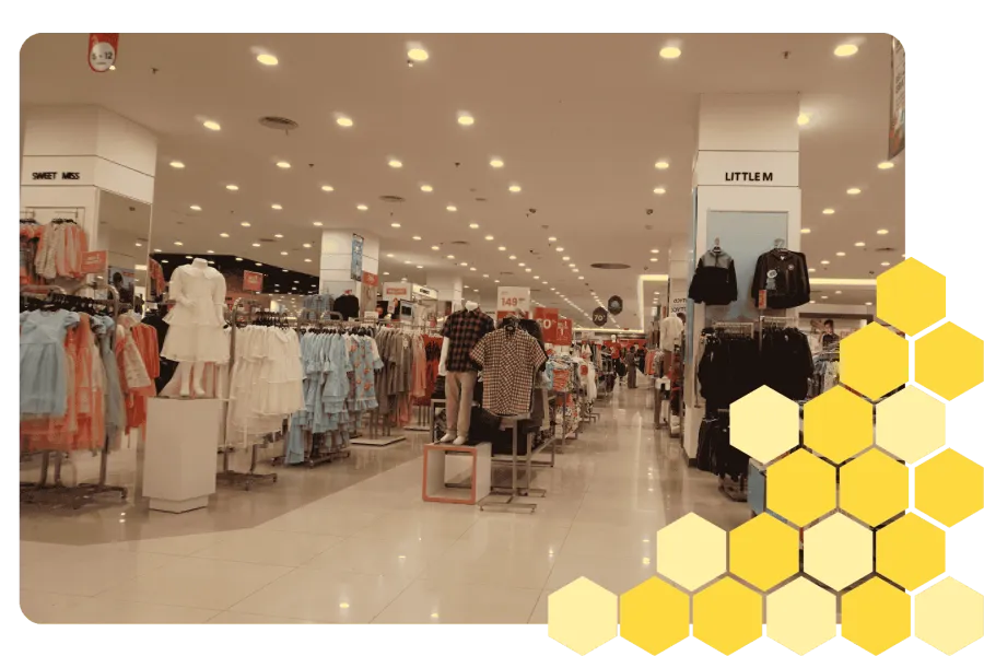 Confident construction engineer in white helmet smiling with teammates and heavy machinery in background