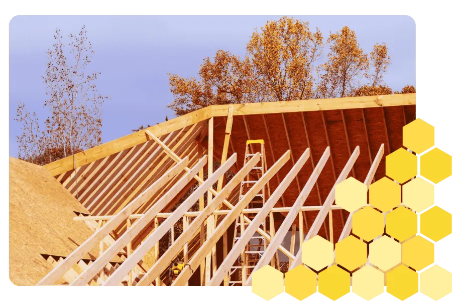 Cozy modern restaurant interior with velvet seating, wooden tables, and colorful hanging light fixtures.