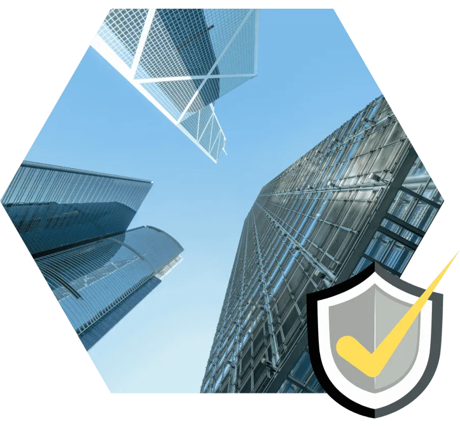 Upward view of modern glass skyscrapers against a clear blue sky in a hexagonal crop with shield icon overlay.