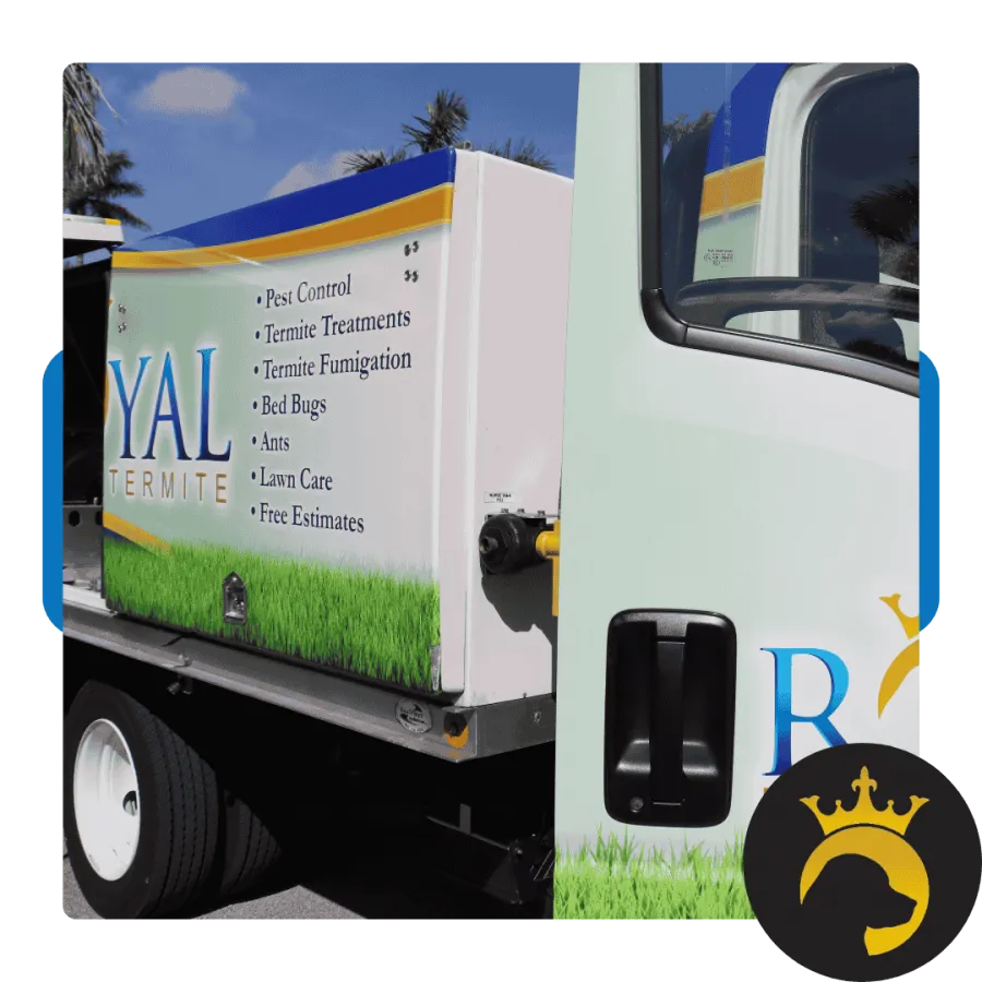 Pest control service truck with list of treatments including termite, bed bugs, ants, and lawn care services.
