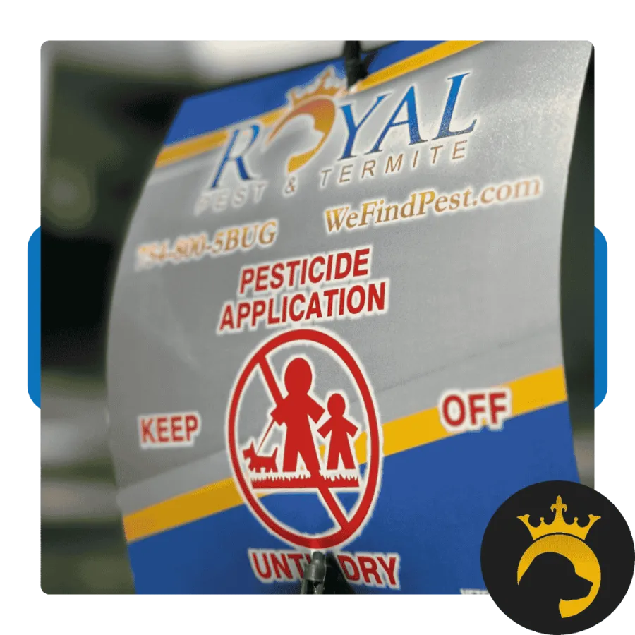 Royal Pest & Termite sign warning pesticide application with keep off untoward symbol and contact information.