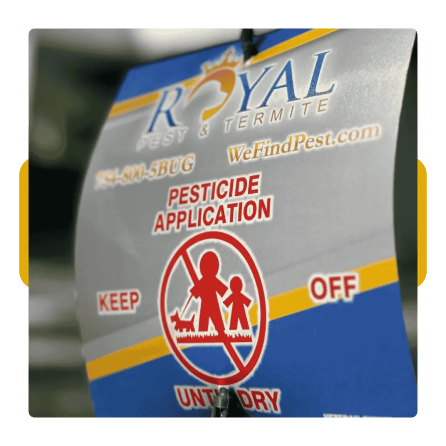 Royal Pest & Termite pesticide application sign warning to keep children and pets off treated area.